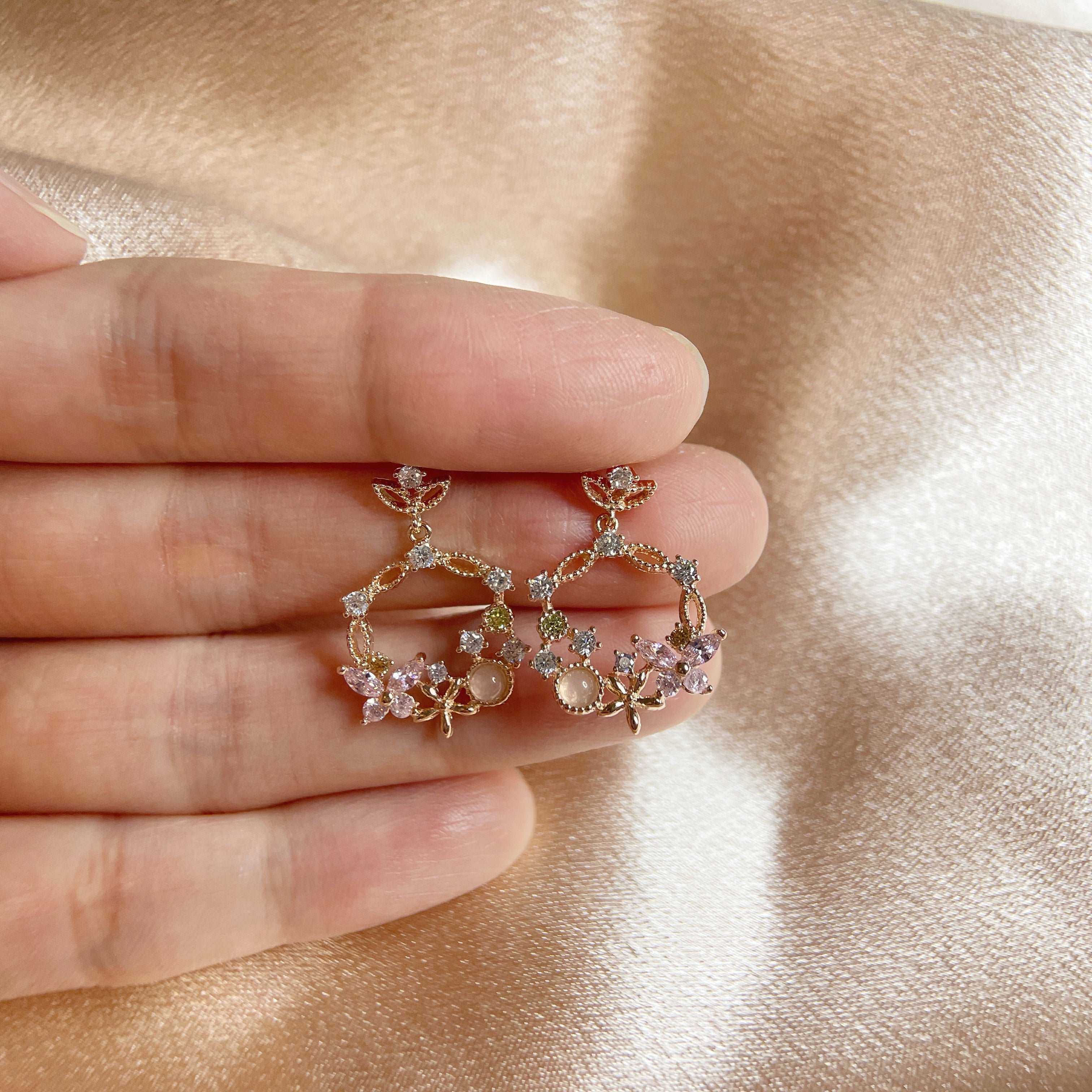 Pair of Rose Gold Drop earrings crafted with pink gemstone in butterfly design enriched by a flower wreath highlighted by Cubic Zirconia. Ideal colorful Jewelry gift for her in different occasions - Sisilia Jewels