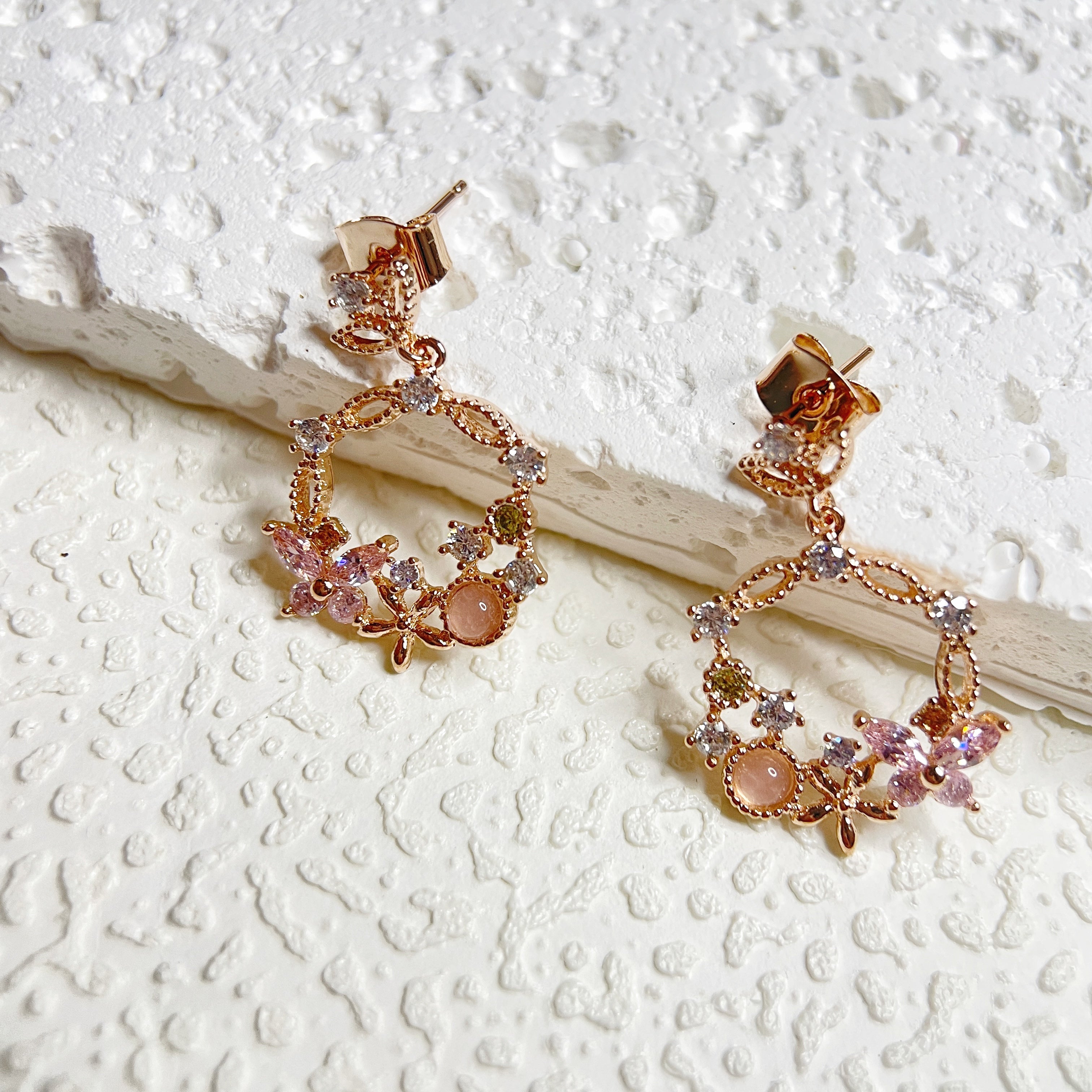 Rose gold butterfly and flower design drop earrings crafted with sparkle multi colored stones - Sisilia Jewels
