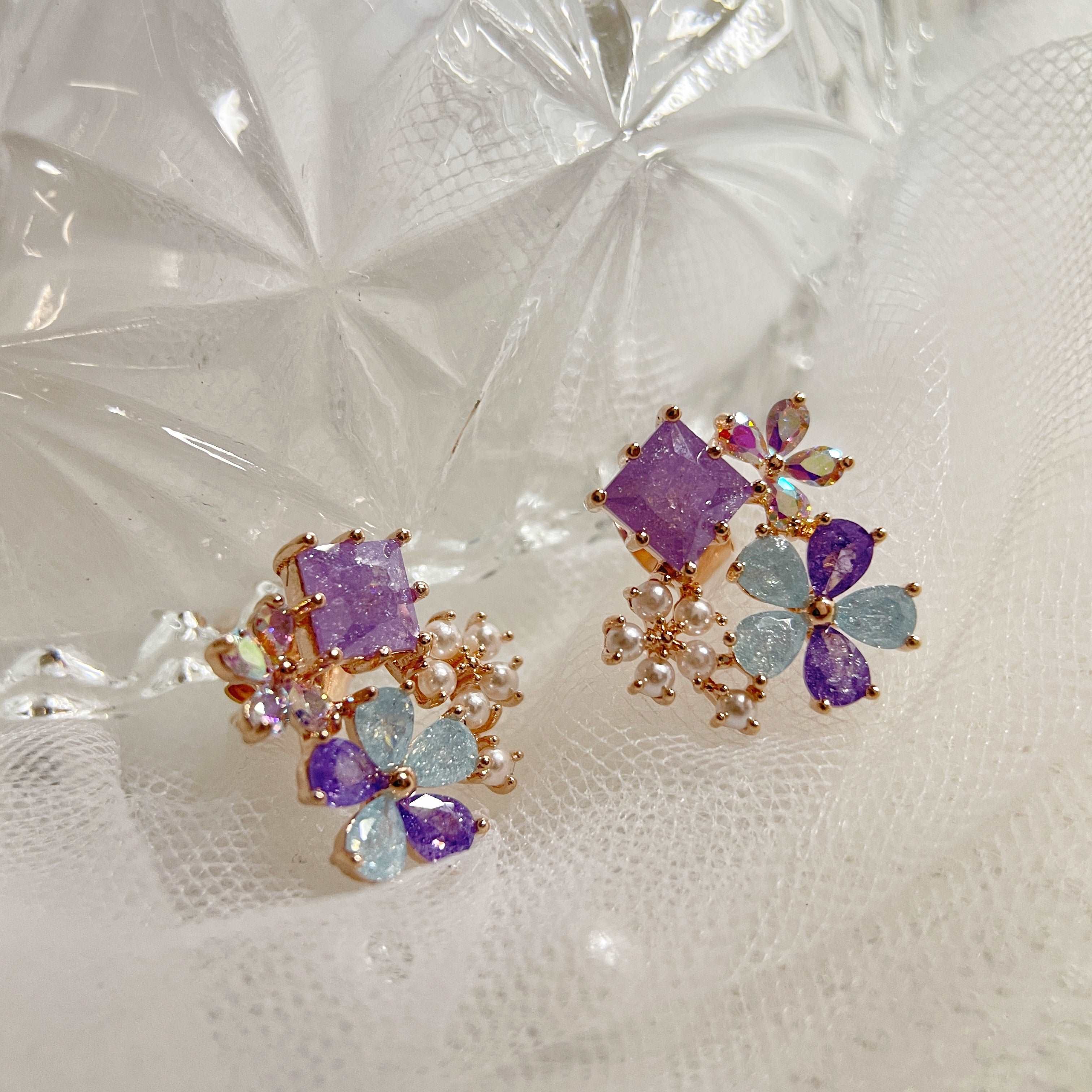 Pair of multi colored stone earring studs crafted with tiny pearls, sparkle crystals, amethyst and aquamarine in dream ethereal bloom style - Sisilia Jewels