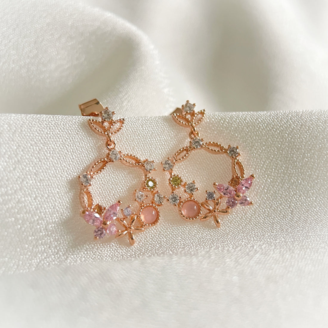 Pair of Rose Gold Drop earrings crafted with pink gemstone in butterfly design enriched by a flower wreath highlighted by Cubic Zirconia. Ideal colorful Jewelry gift for her in different occasions - Sisilia Jewels