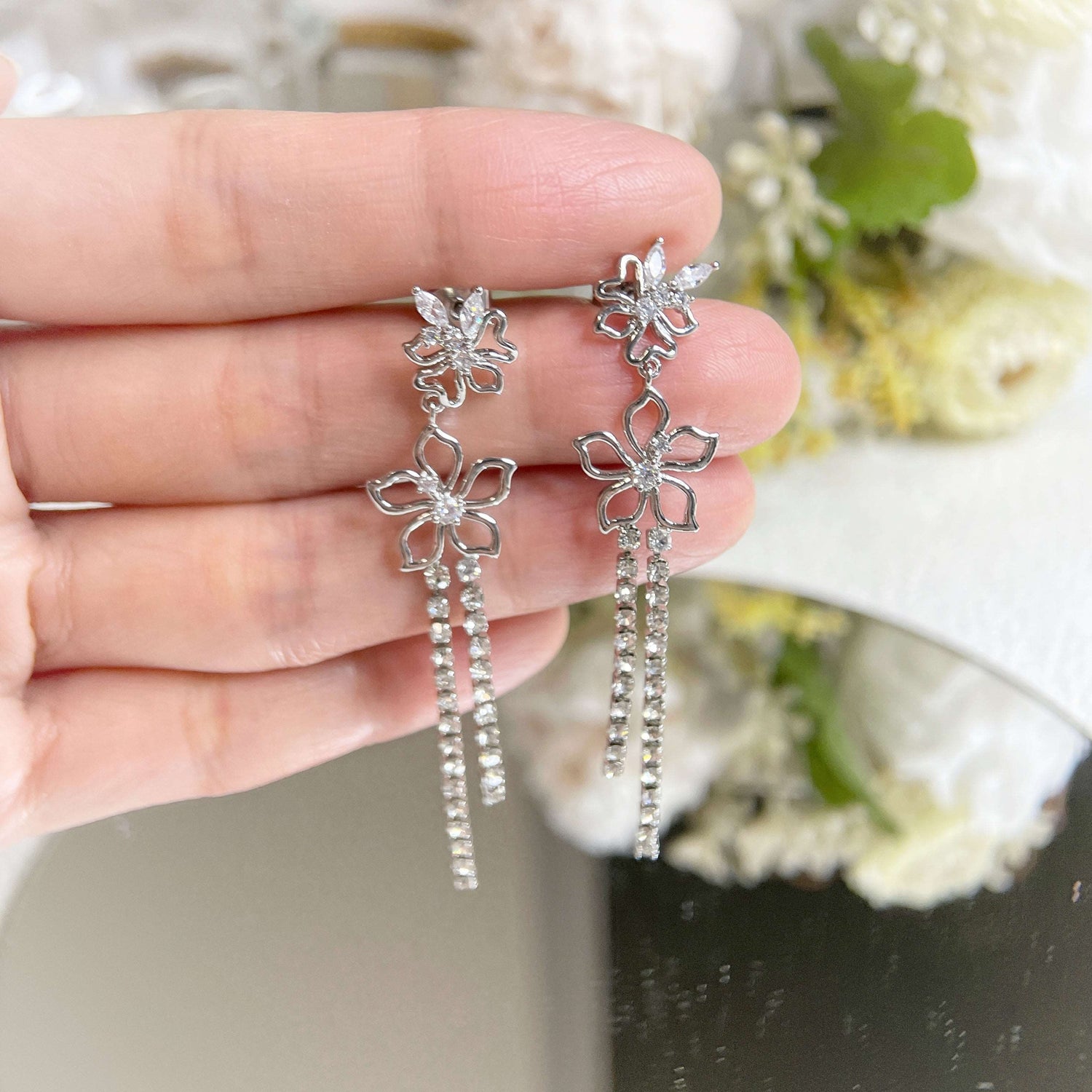 Pair of silver earring dangles in Cubic zirconia cz stones butterfly wing and twin forget-me-not flower design, with two sparkle rhinestone tassels - Sisilia Jewels