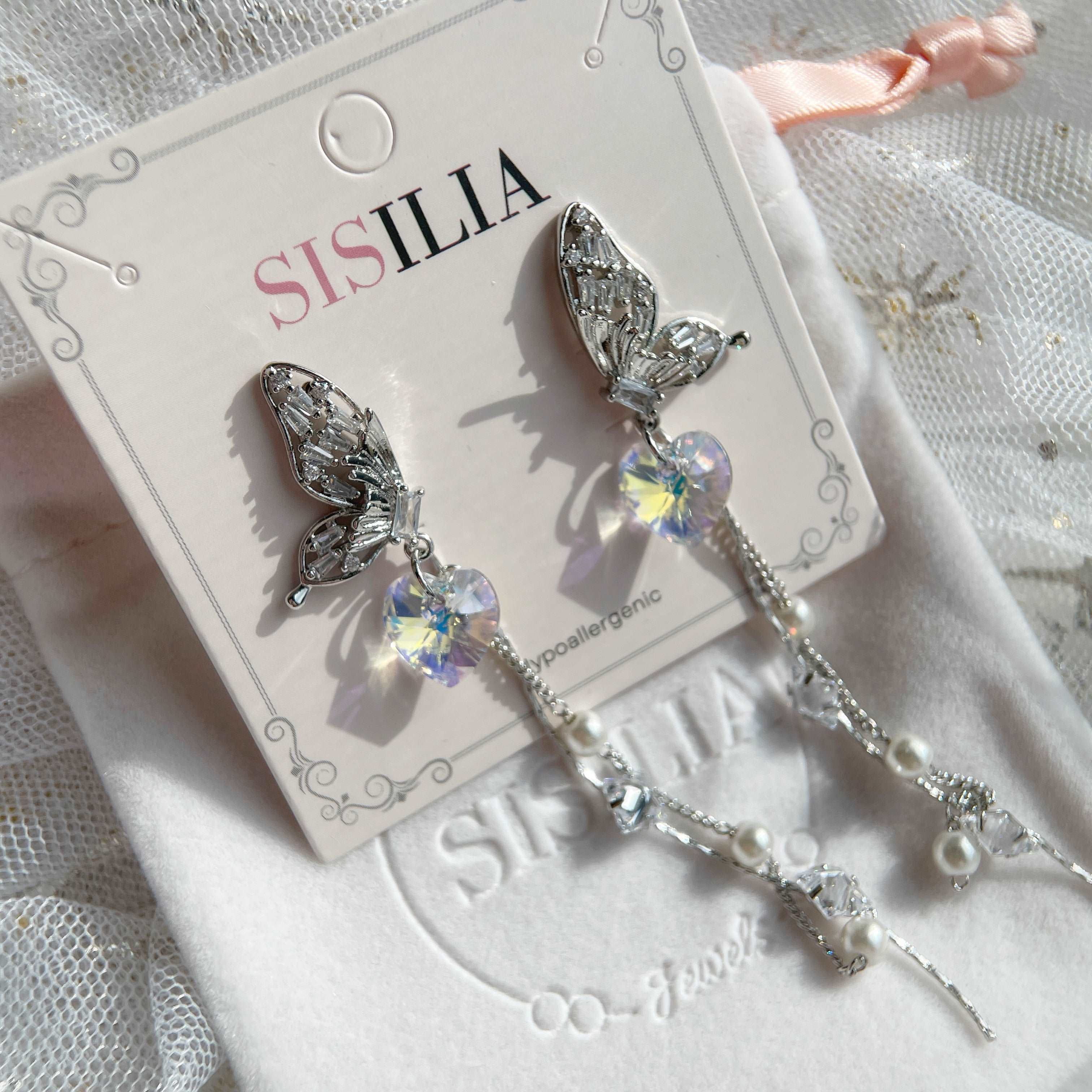 Earring dangles with paved butterfly wing design ,a heart shaped Swarovski Crystal and long tassels - Sisilia Jewels