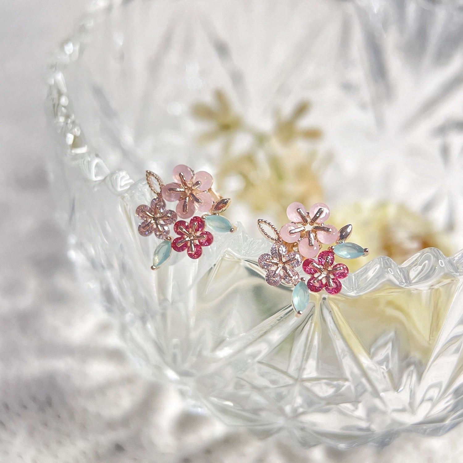 Pair of triple cluster flower earrings studs design in pink, mint green and red, highlighted by rose gold colour  leaves with push back earring pin closure -  Sisilia Jewels