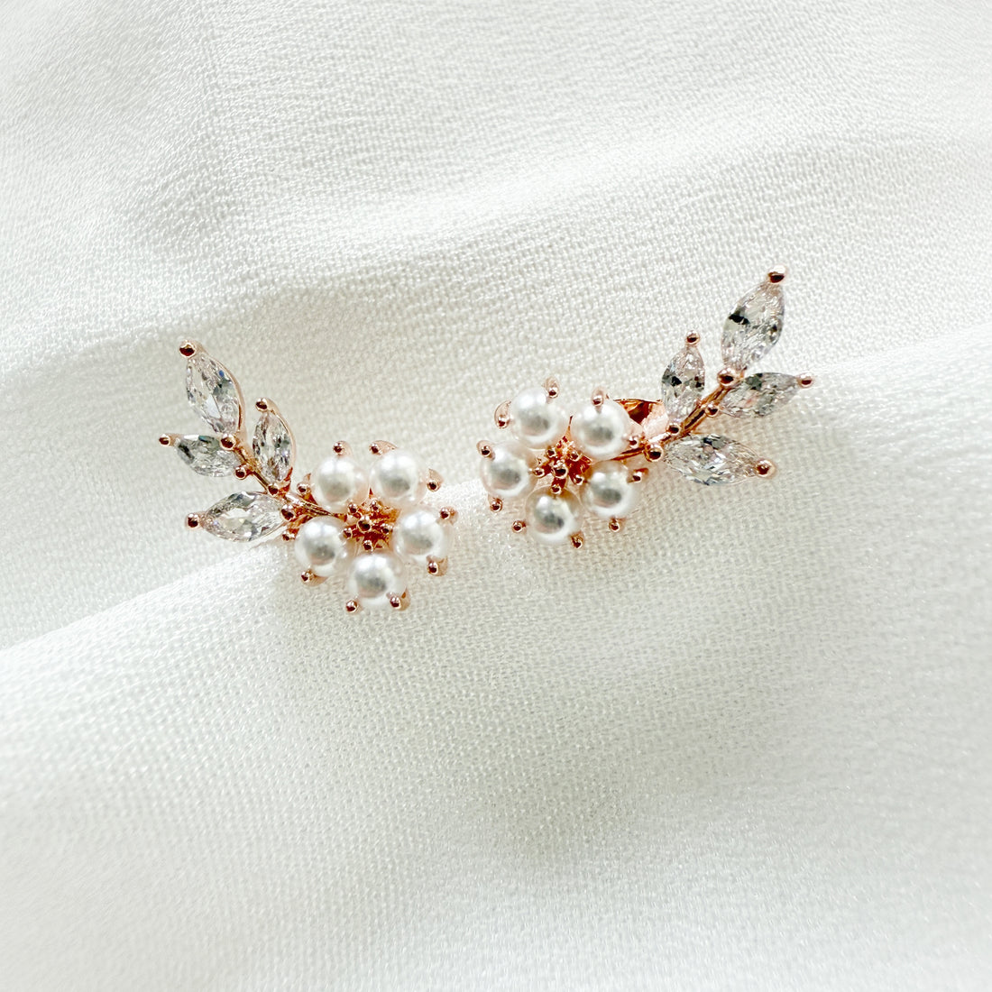 Crafted with tiny pearls for flower design with sparkly cubic zirconia leaves branch which looks like a wing. Nature-inspired design in dainty dreamy cute minimalist style for everyday wear