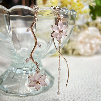 Mismatched earrings in six petals pink flower hanging on rose gold flower stems preventing - Sisilia Jewels