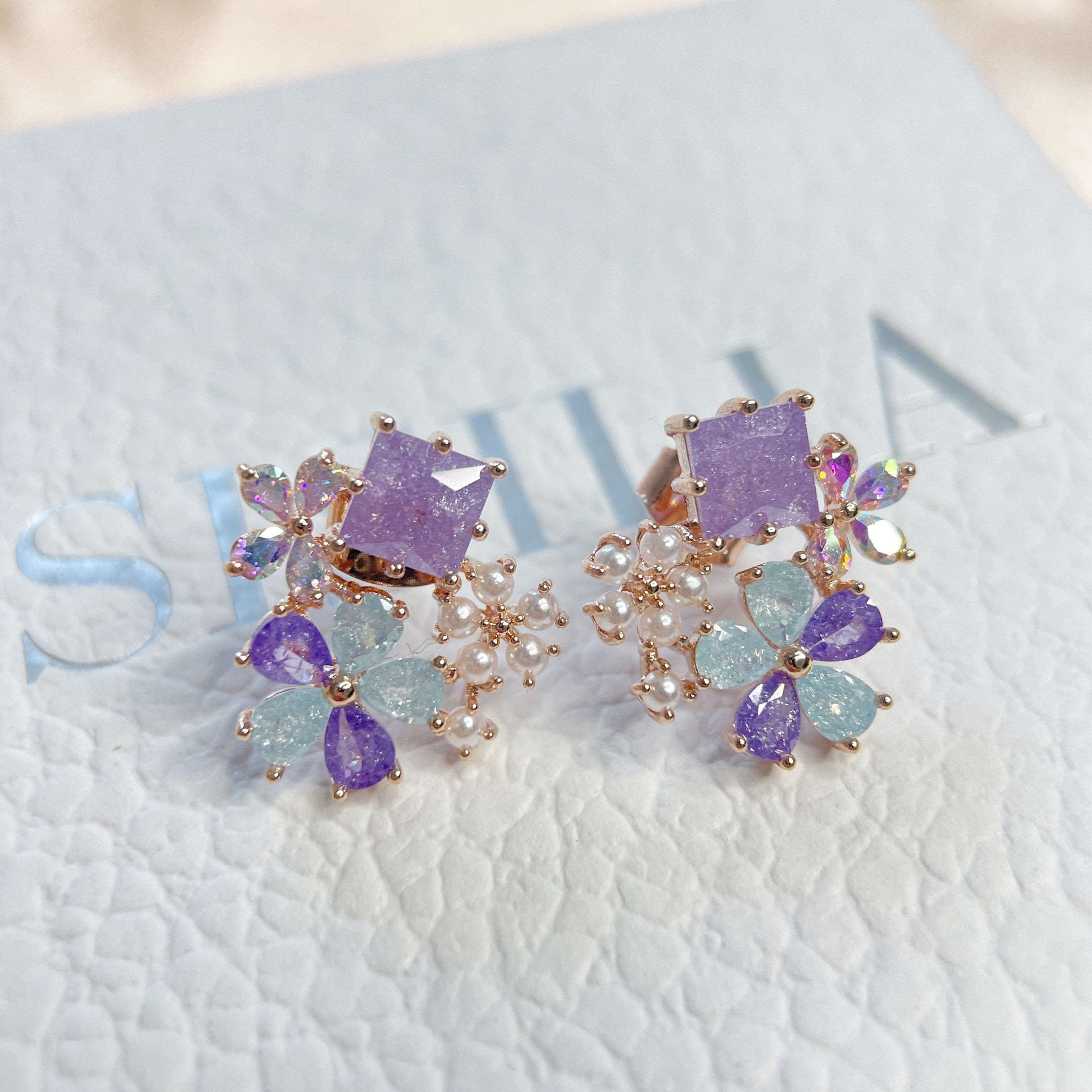 Pair of  multi colored stone earring studs crafted with tiny pearls, sparkle crystals, amethyst and aquamarine in dream ethereal bloom style - Sisilia Jewels